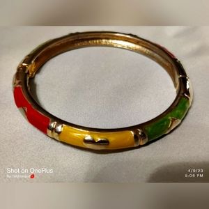 Gold plated with enamel from Saks